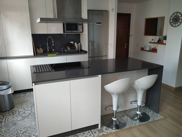 Fridge, microwave, cookware/dishes/utensils