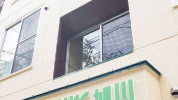 A building with a sign that reads "TKD HOUSE".