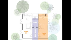 Grundriss eines Hotels mit zwei Studios, einem Gemeinschaftsbereich und zwei Schlafzimmern.