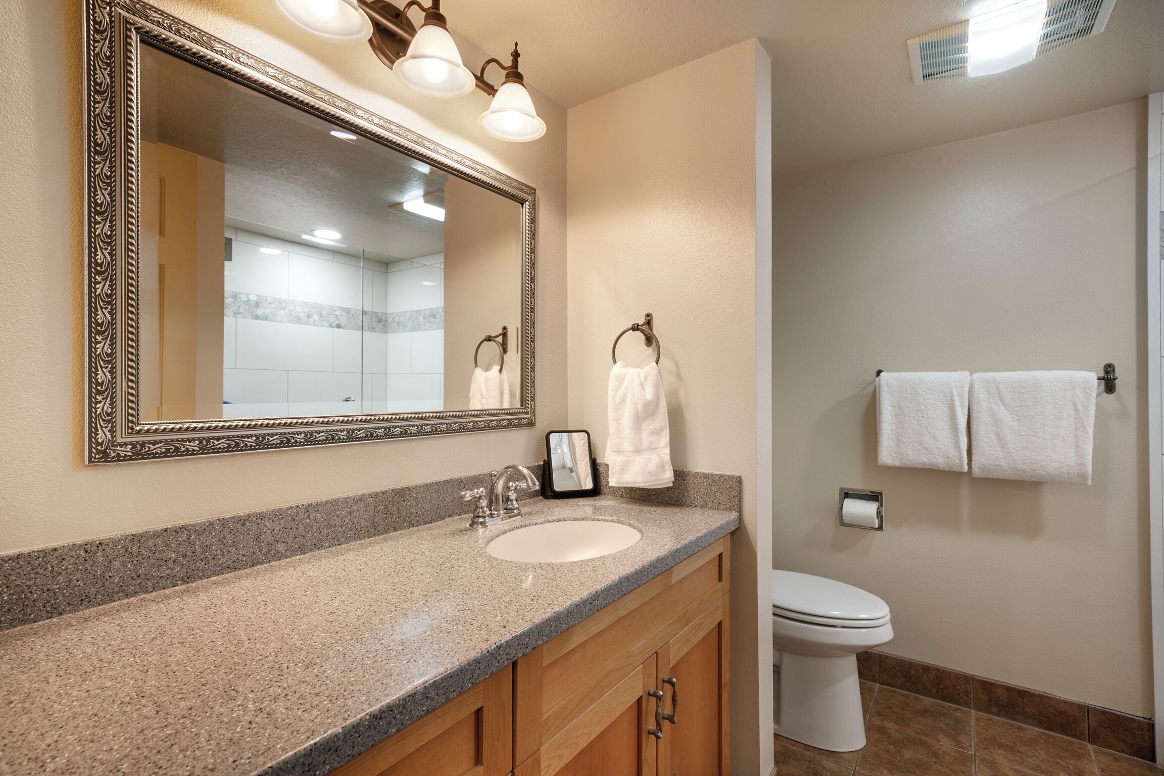 Shower, hair dryer, towels, shampoo