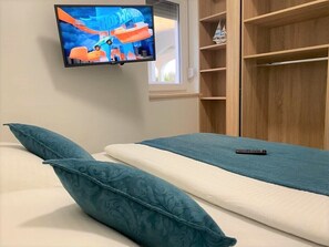 2 chambres, fer et planche à repasser, Wi-Fi, draps fournis