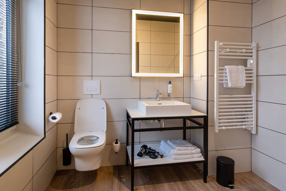 superior double room | bathroom | shower, hair dryer, towels, soap