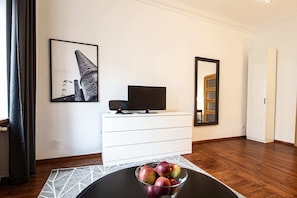 Departamento Confort | Sala de estar | Televisión de pantalla plana 