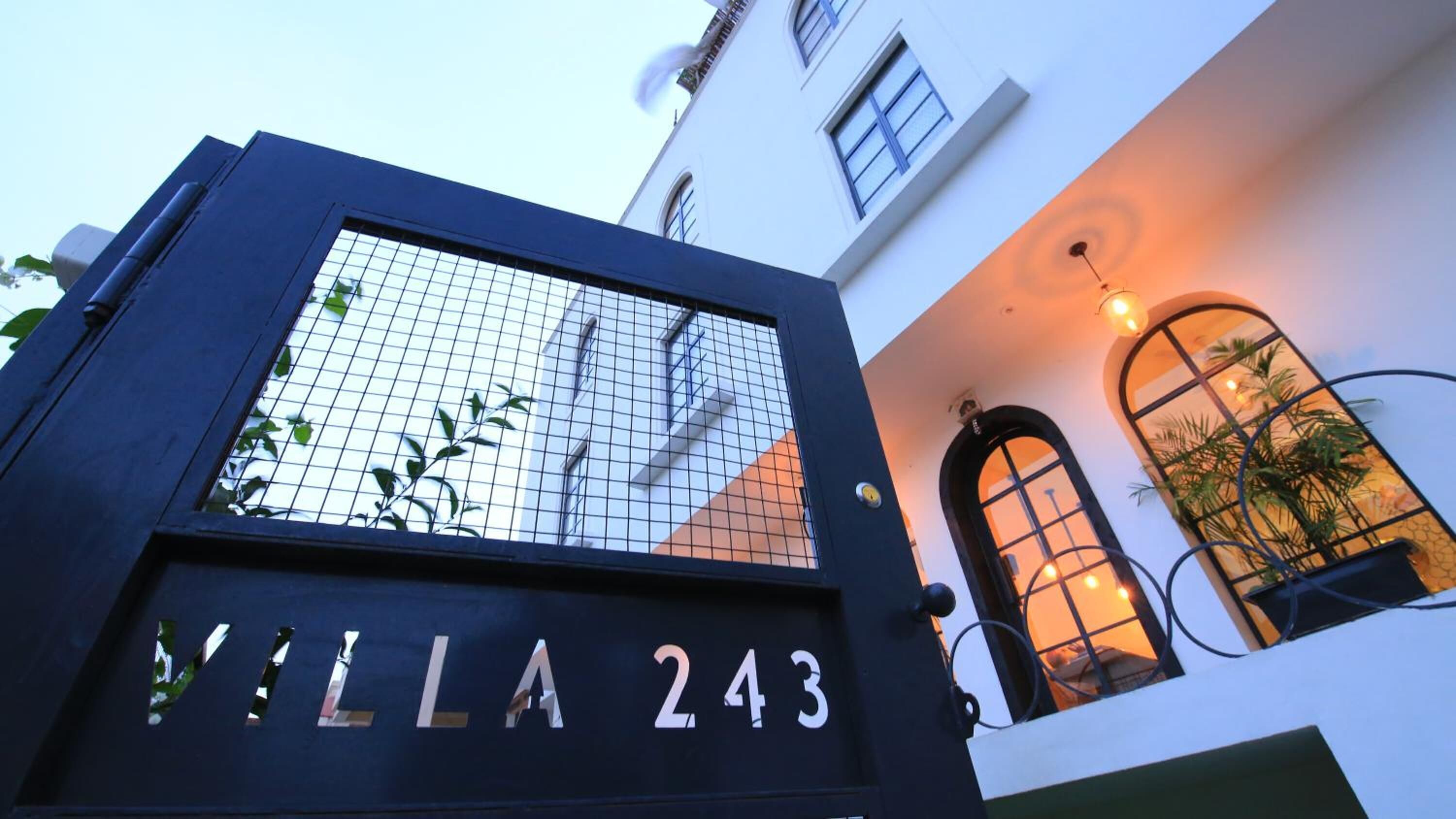 A building entrance with a sign reading "VILLA 243".