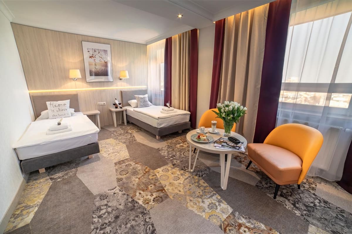 hypo-allergenic bedding, desk, blackout curtains, iron/ironing board