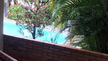 Quarto presidencial, 1 cama King, vista para a piscina | Sacada