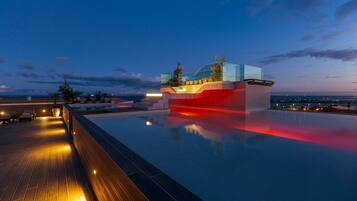 Outdoor pool, open 10:00 AM to 6:00 PM, pool umbrellas, sun loungers