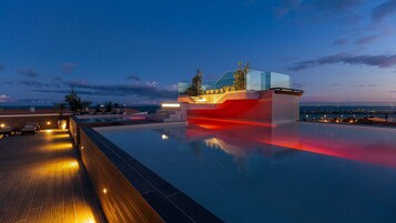 Outdoor pool, open 10:00 AM to 6:00 PM, pool umbrellas, sun loungers
