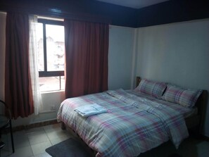 Deluxe Room | 1 bedroom, desk, blackout drapes, free WiFi
