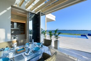 Outdoor dining - Beachfront Villa Natalia with Two Private Pools (Vourvourou, Halkidiki, Sithonia)