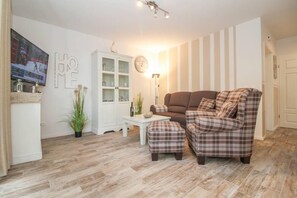 Apartment, 2 Bedrooms | Living area | Flat-screen TV