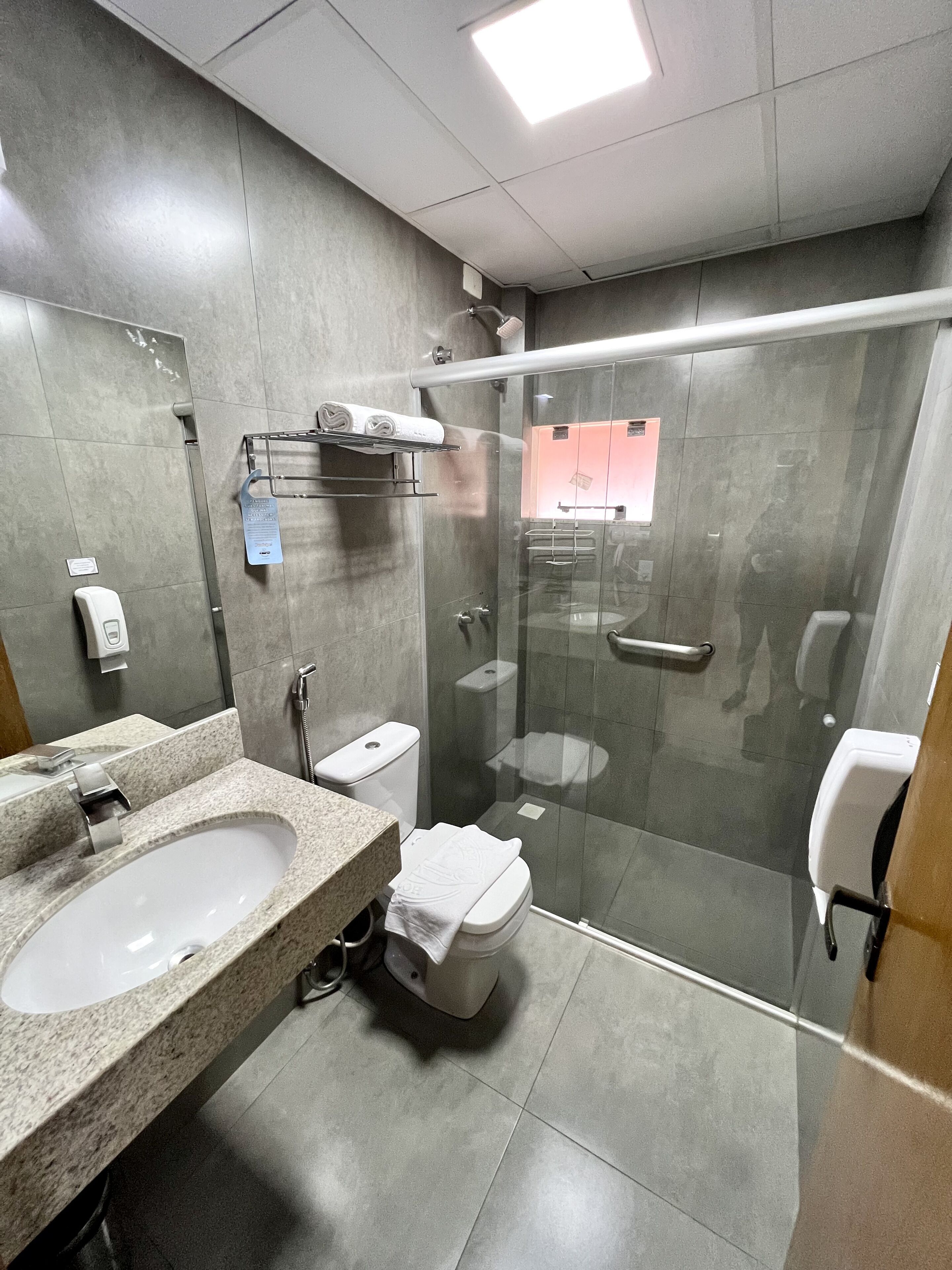 shower, hair dryer, bidet, towels