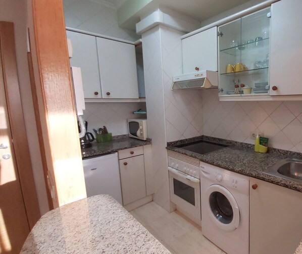 Fridge, microwave, cookware/dishes/utensils