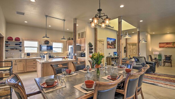A spacious kitchen with wooden cabinets, a central island, and pendant lighting. - Unique Cortez Family Getaway w/ Mountain Views! (Cortez)