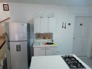 Full-sized fridge, oven, stovetop, espresso maker