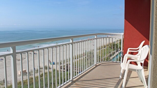 A balcony with a view of the beach and ocean. - Grand Atlantic by Palmetto Vacations (Myrtle Beach)