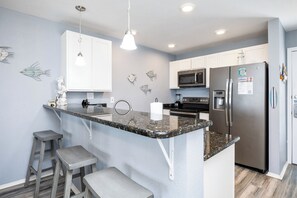 Fridge, microwave, oven, stovetop - Beachside Condo Steps from the Sand with Pool, Hot Tub, and Private Balconies (Corpus Christi)