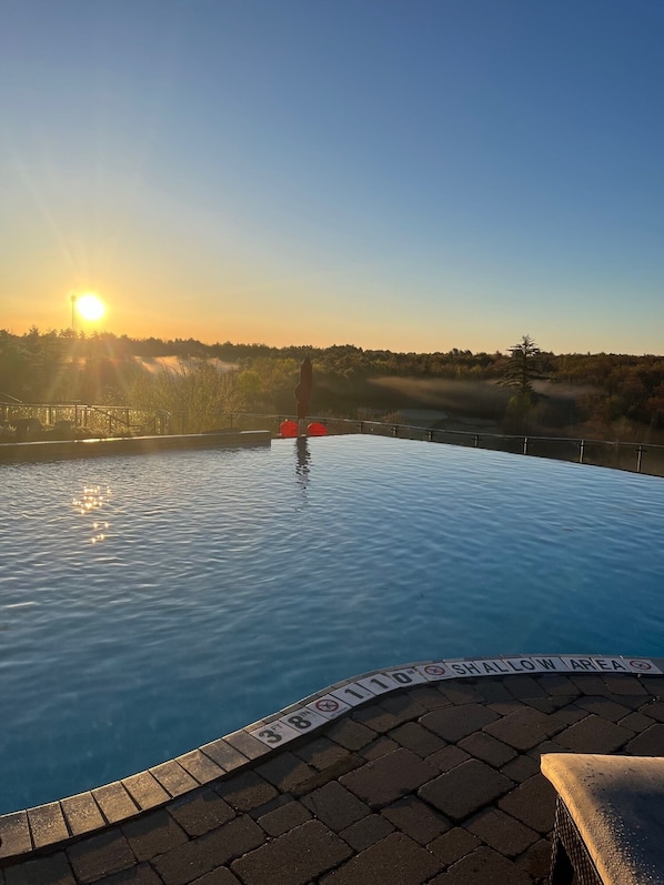 Seasonal outdoor pool, open 8:00 AM to 8:00 PM, free pool cabanas