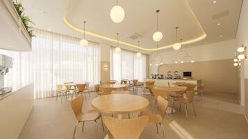 A modern dining area with round tables and chairs, large windows with sheer curtains, and pendant lighting.