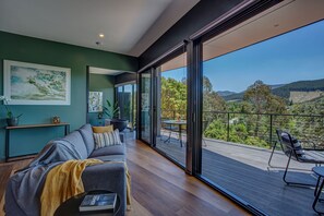 Apartment 1 | Living area | 65-inch TV with satellite channels, fireplace, Netflix - The View Bright (Bright)