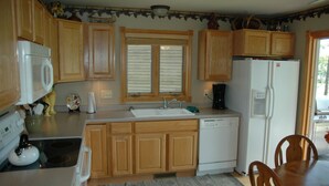 Comfort Cabin | Private kitchen | Coffee/tea maker, full-size fridge, microwave, oven - Apostle Pines 4 by Winfield Inn (Bayfield)