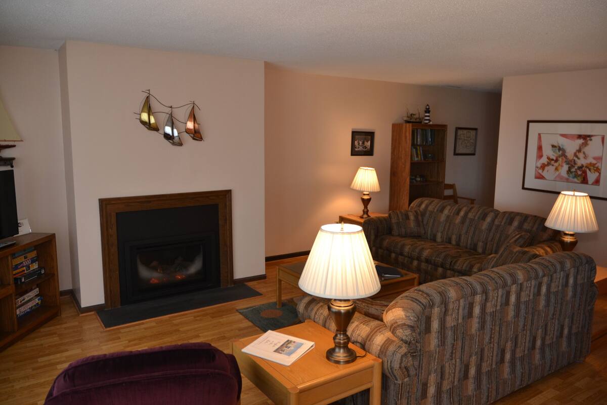 Condo 101 By Winfield Inn | Living area | 40-inch LCD TV with digital channels, TV, fireplace