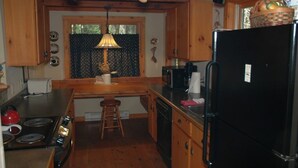 Comfort Cabin | Private kitchen | Coffee/tea maker, full-sized fridge, microwave, oven - Brickyard Cottage 1 by Winfield Inn (Bayfield)