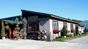 A building with a sign reading "CHFA WINERY".