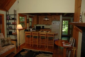 Comfort Cabin | Living area | 32-inch LCD TV with cable channels, TV, fireplace - Brickyard Cottage 4 by Winfield Inn (Bayfield)