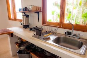 Microwave, coffee/tea maker, blender, cookware/dishes/utensils