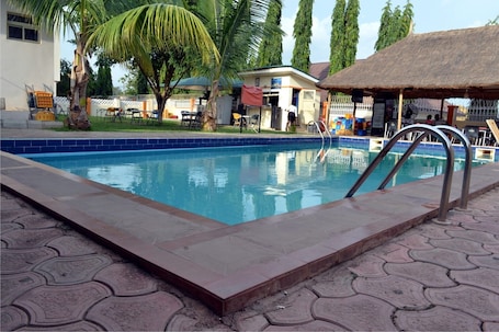Outdoor pool. Franzy Suites And Lounge