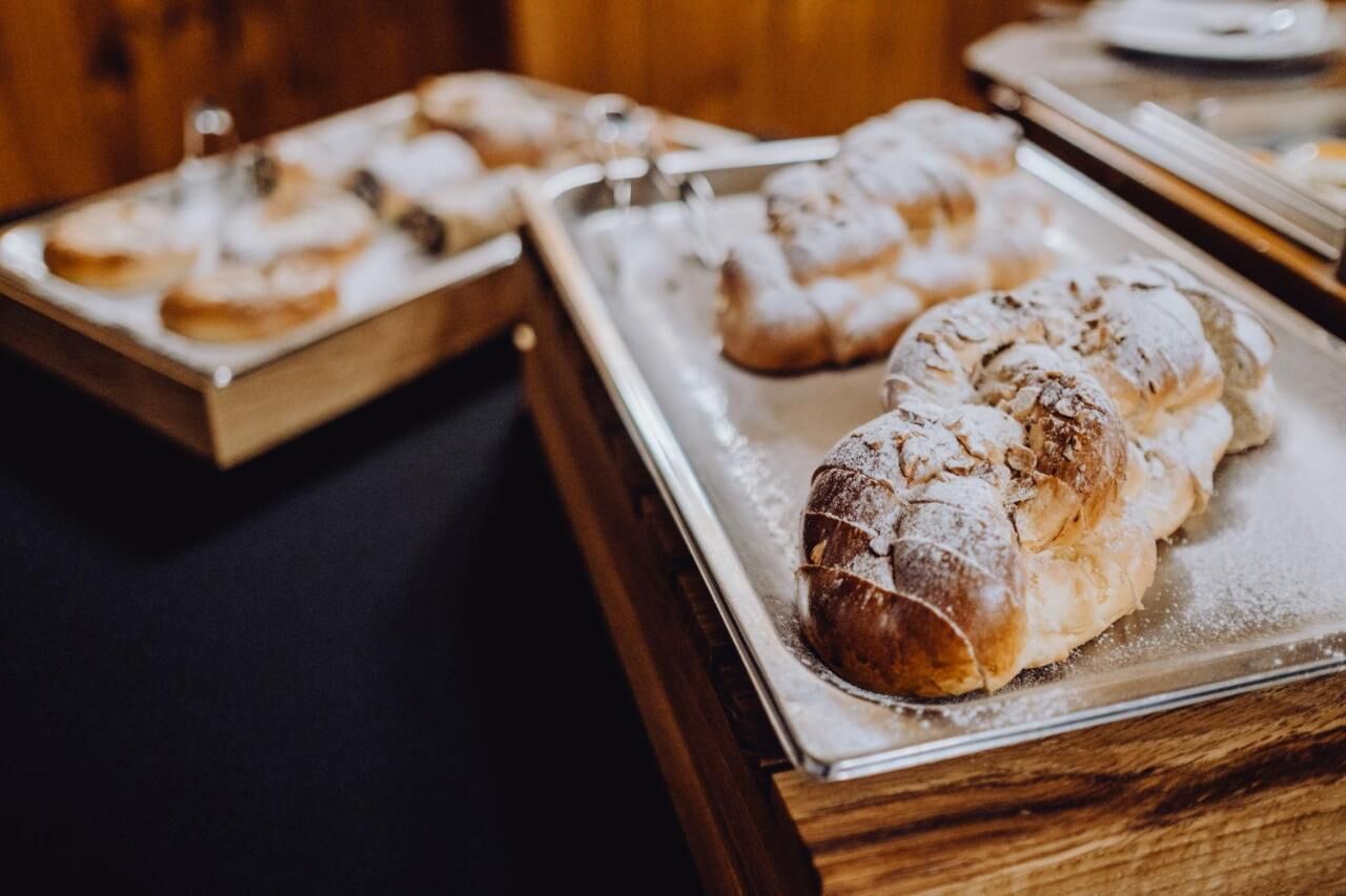 A tray of pastries on a wooden table.