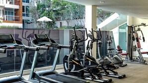 A modern gym with multiple treadmills, stationary bikes, and weight machines. - SEACRAZE D709 - 2 Bedroom - Near Beach (Hua Hin)