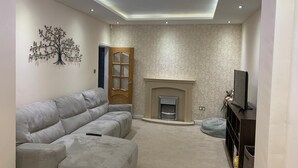 Comfort House | Living room | Flat-screen TV, toys - Family Home (Manchester)