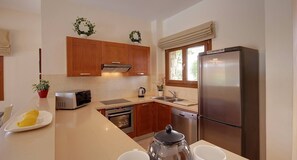 Villa | Private kitchen | Full-size fridge, microwave, oven, stovetop