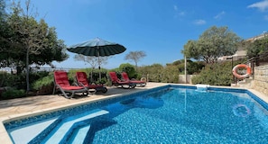 Outdoor pool, pool umbrellas, pool loungers