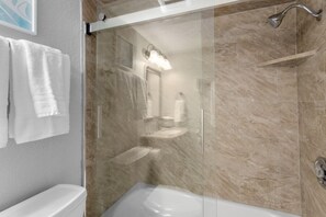 Combined shower/tub, hair dryer, towels, soap
