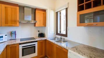 Apartment | Private kitchen | Full-size fridge, microwave, oven, stovetop