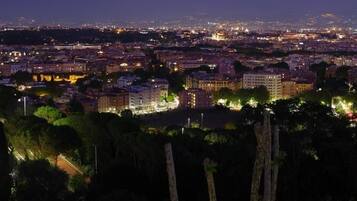 A nighttime cityscape with illuminated buildings and streets.