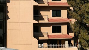 A multi-story building with a sign for RINCHEN HOTEL, located in Boudha-6, Kathmandu. - Rinchen Hotel (Kathmandu)