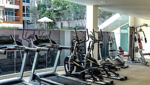 A modern gym with multiple treadmills, stationary bikes, and weight machines. - SEACRAZE D702 - 1 Bedroom - Near Beach (Hua Hin)