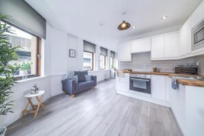 Deluxe-Apartment | Wohnzimmer | Flachbildfernseher