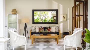 Exclusive Villa, 2 Bedrooms | Living room | 40-inch LCD TV with cable channels, TV