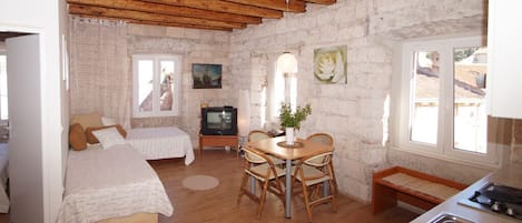 Deluxe Apartment, 1 Bedroom | Living area | Flat-screen TV