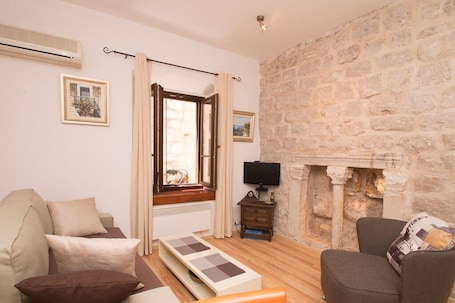 Apartment, 1 Bedroom | Living area | Flat-screen TV