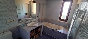 Shower, hair dryer, towels, soap