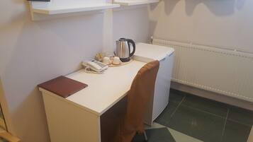 Standard Triple Room | Living area | Flat-screen TV