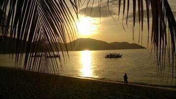 On the beach, sun-loungers