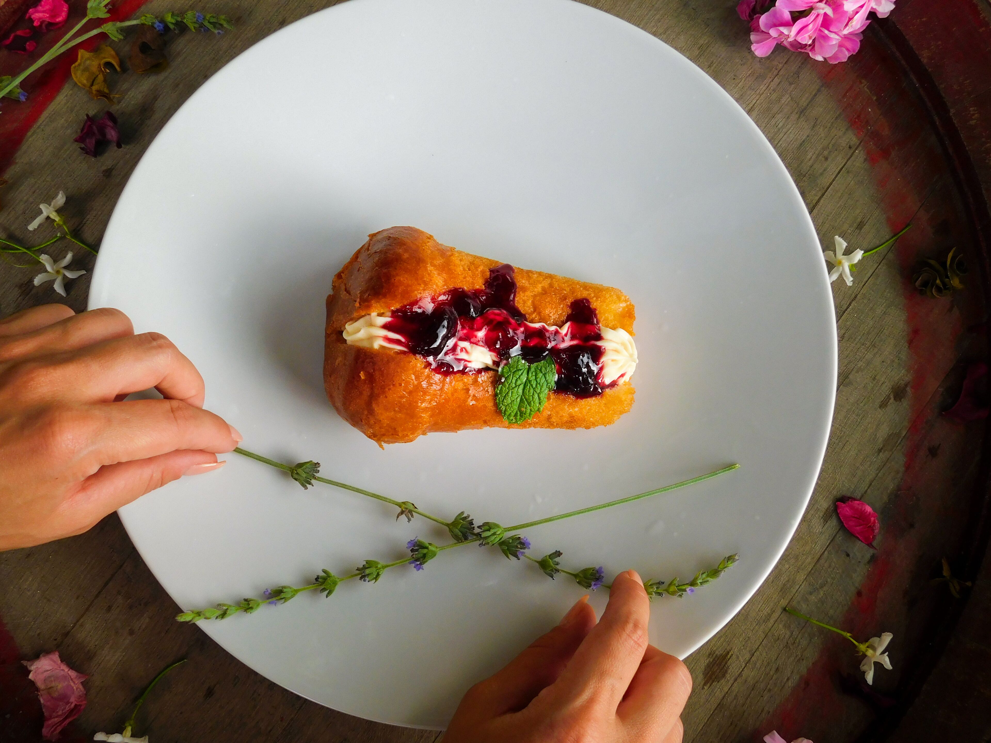 A dessert on a white plate with a wooden table background.
