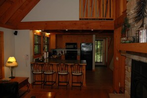 Comfort Cabin | Living area | 32-inch LCD TV with cable channels, TV, fireplace - Brickyard Cottage 20 by Winfield Inn (Bayfield)